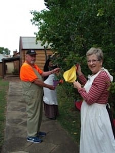 Volunteers Stan and marjorie Bell along with jean Lycette adorned the quince tree with 'fruit'